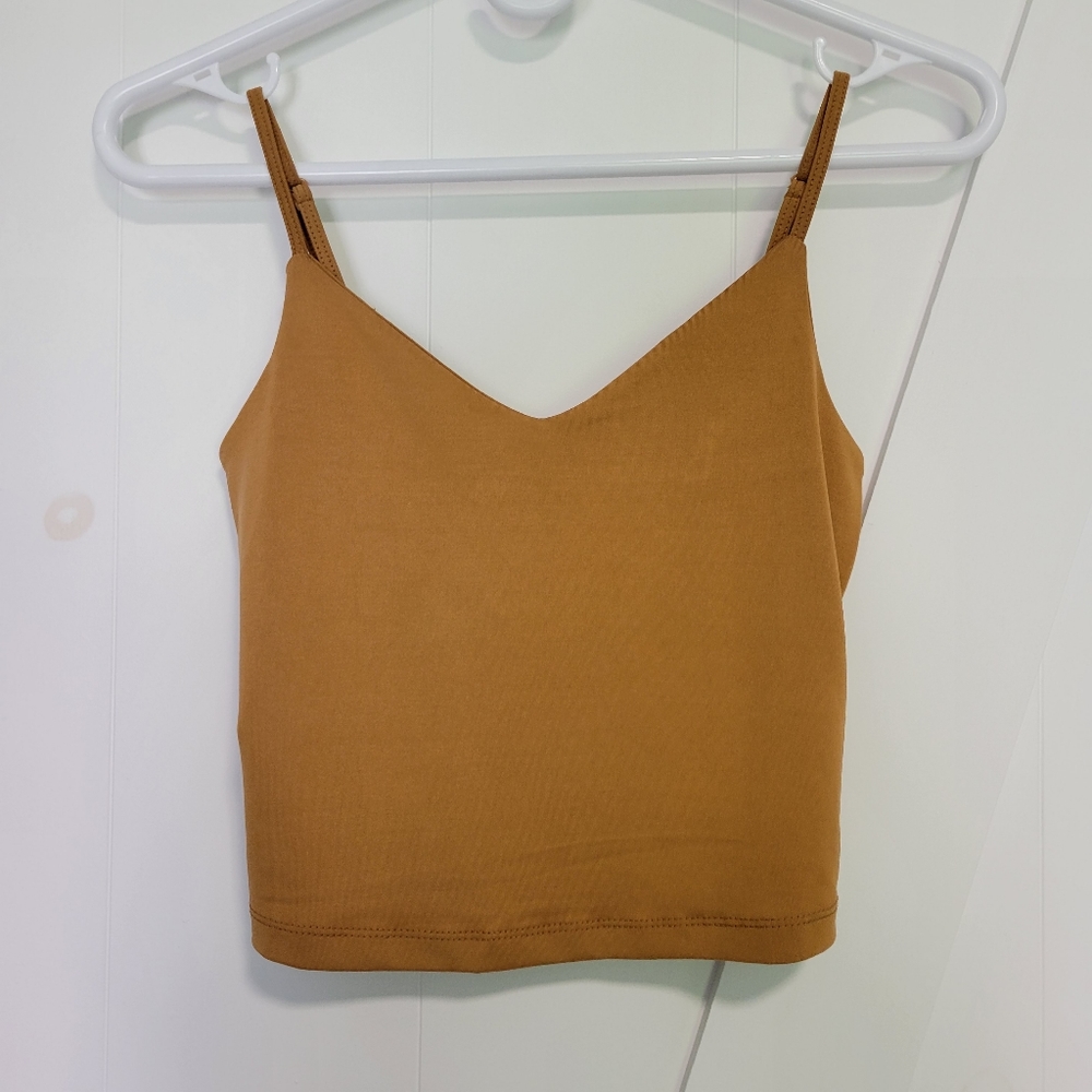 Dynamite crop top xs in golden colour. Worn once. Great with a waist high skirt.